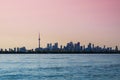 Toronto cityscape with skyscraper, calm lake water. urban skyline background. sunset time Royalty Free Stock Photo