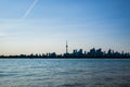 Toronto cityscape with skyscraper, calm lake water. urban skyline silhouette background. blue tone. Royalty Free Stock Photo