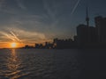 Toronto with cn tower during sunset over lake ontario seen from toronto island ferry Royalty Free Stock Photo