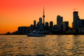 Toronto downtown cityscape with skyscrapers, white yacht and amazing color sunset sky Royalty Free Stock Photo