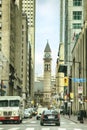 TORONTO - NOVEMBER 22, 2017: Old City Hall Tower, view from Bay Street with cars and pedestrians, in Toronto, Canada Royalty Free Stock Photo