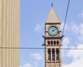 Toronto Old City Hall clock tower with streetcar wires and highrise building in downtown Royalty Free Stock Photo