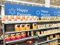 Toronto, Ontario, Canada - April 10, 2022: Happy Passover sign in store grocery shop Walmart. Shelves with food for Jewish spring