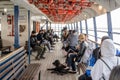 TORONTO, ONTARIO, CANADA - APRIL 25, 2021: PEOPLE WEAR FACE MASKS ON FERRY TO TORONTO ISLANDS DURING COVID-19 PANDEMIC.