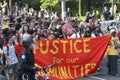 Crowd of multi-ethnic men and woman walking on street protest against G-20 meeting in Toronto