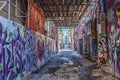 Graffiti in an alley in the Kensington Market. Street art or mural painting on display at Toronto`s Graffiti Alley Royalty Free Stock Photo