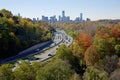 High angle view of the colorful Don Valley Parkway traffic in autumn with the downtown skyline Royalty Free Stock Photo