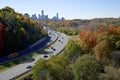 High angle view of the colorful highway traffic in autumn with the downtown skyline Royalty Free Stock Photo