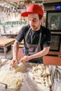 TORONTO, ONTARIO, CANADA - MARCH 6, 2018: CHEF PREPARES FOOD IN KITCHEN