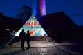 Couple looking at the art display in the Toronto Light Festival Royalty Free Stock Photo