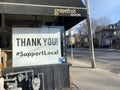 TORONTO, ONTARIO, CANADA - MARCH 22, 2021: SIGNAGE SUPPORTING LOCAL BUSINESS DURING COVID-19 PANDEMIC.