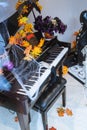 Amazing inviting theatrical view, Halloween decoration with funny scary dead hand playing piano at down town Toronto music store