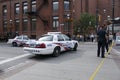 Police line tape and police cars set up to block the area Royalty Free Stock Photo