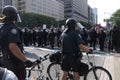 Riot police in full gear to control thousands of activists marching along University Avenue in a protest ahead of the G20 summit