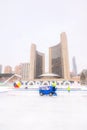 Toronto, Ontario - December 2, 2019 : An ice resurfacer Zamboni cleaning the ice rink at Nathan Phillips Square NPS City Hall Royalty Free Stock Photo