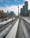 Toronto, Ontario - January 20, 2019 : A GO Train in motion heading downtown towards Union Station and CN Tower