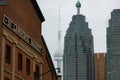 Toronto, Ontario - November 18, 2019 : The CN Tower framed between St. Lawrence Market and the Financial District skyline