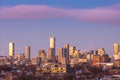 Toronto skyline lights beginning to turn on with colorful sunset clouds overhead. Royalty Free Stock Photo