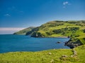 From Torr Head, clear blue water and green hills around the spectacular Antrim Causeway Coast in Northern Ireland, UK Royalty Free Stock Photo