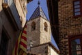 Torre de las horas in Solsona between a catalonia flag