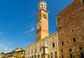 Torre dei Lamberti clock tower of Palazzo della Ragione palace building in Piazza Delle Erbe Royalty Free Stock Photo