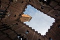 Torre del Mangia, clock tower of a city hall on Piazza del Campo main square in Siena, Tuscany Royalty Free Stock Photo