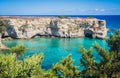 Torre Sant Andrea rocky sea coast with turquoise water and juniper, Apulia Italy