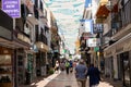 TORREMOLINOS, SPAIN, Andalusia, Costa del Sol - May 21, 2019. Shopper and tourists are walking along most popular street in old Royalty Free Stock Photo