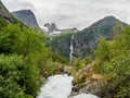 Torrent and mountains near briksdalsbreen Glacier in Norway Royalty Free Stock Photo