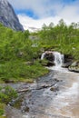 Torrent plunges from the mountains on Lofoten, Nordland, Norway Royalty Free Stock Photo