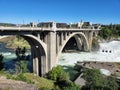 Torrential Lower Spokane Falls after heavy rains on sunny summer morning. Royalty Free Stock Photo