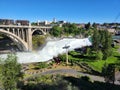 Torrential Lower Spokane Falls after heavy rains on sunny summer morning. Royalty Free Stock Photo