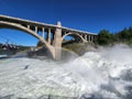 Torrential Lower Spokane Falls after heavy rains on sunny summer morning. Royalty Free Stock Photo