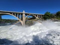 Torrential Lower Spokane Falls after heavy rains on sunny summer morning. Royalty Free Stock Photo