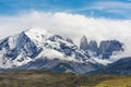 Torres del Paine peaks coming from clouds