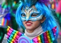 TORREVIEJA, SPAIN FEBRUARY 12, 2023: Close up portrait of a girl in a colorful carnival costume at a festive parade, Alicante