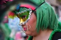 TORREVIEJA, SPAIN FEBRUARY 12, 2023: Close up portrait of a girl in a colorful carnival costume at a festive parade, Alicante