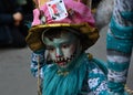 TORREVIEJA, SPAIN FEBRUARY 12, 2023: Close up portrait of a kid in a colorful carnival costume at a festive parade, Alicante,