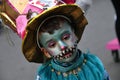 TORREVIEJA, SPAIN FEBRUARY 12, 2023: Close up portrait of a kid in a colorful carnival costume at a festive parade, Alicante,