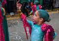 TORREVIEJA, SPAIN FEBRUARY 12, 2023: Little Girl in a fancy carnival costume at a Mardi Gras parade, Alicante, Costa blanca region