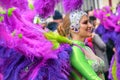 TORREVIEJA, SPAIN FEBRUARY 12, 2023: Participants dressed in a colorful carnival costumes on the street during the traditional