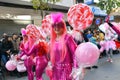 TORREVIEJA, SPAIN FEBRUARY 12, 2023: Participants dressed in a colorful carnival costumes on the street during the traditional