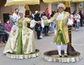 TORREVIEJA, SPAIN FEBRUARY 12, 2023: Participants dressed in a colorful carnival costumes on the street during the traditional