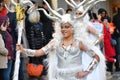 TORREVIEJA, SPAIN FEBRUARY 12, 2023: Participants dressed in a colorful carnival costumes on the street during the traditional