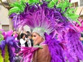 TORREVIEJA, SPAIN FEBRUARY 12, 2023: Participants dressed in a colorful carnival costumes on the street during the traditional