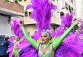 TORREVIEJA, SPAIN FEBRUARY 12, 2023: Participants dressed in a colorful carnival costumes on the street during the traditional