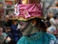 TORREVIEJA, SPAIN FEBRUARY 12, 2023: Participants dressed in a colorful carnival costumes on the street during the traditional