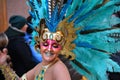 TORREVIEJA, SPAIN FEBRUARY 12, 2023: Participants dressed in a colorful carnival costumes on the street during the traditional