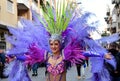 TORREVIEJA, SPAIN FEBRUARY 12, 2023: Participants dressed in a colorful carnival costumes on the street during the traditional