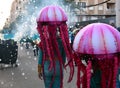 TORREVIEJA, SPAIN FEBRUARY 12, 2023: Participants dressed in a colorful carnival costumes on the street during the traditional